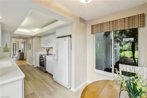 a view of a kitchen cabinets and wooden floor kitchen