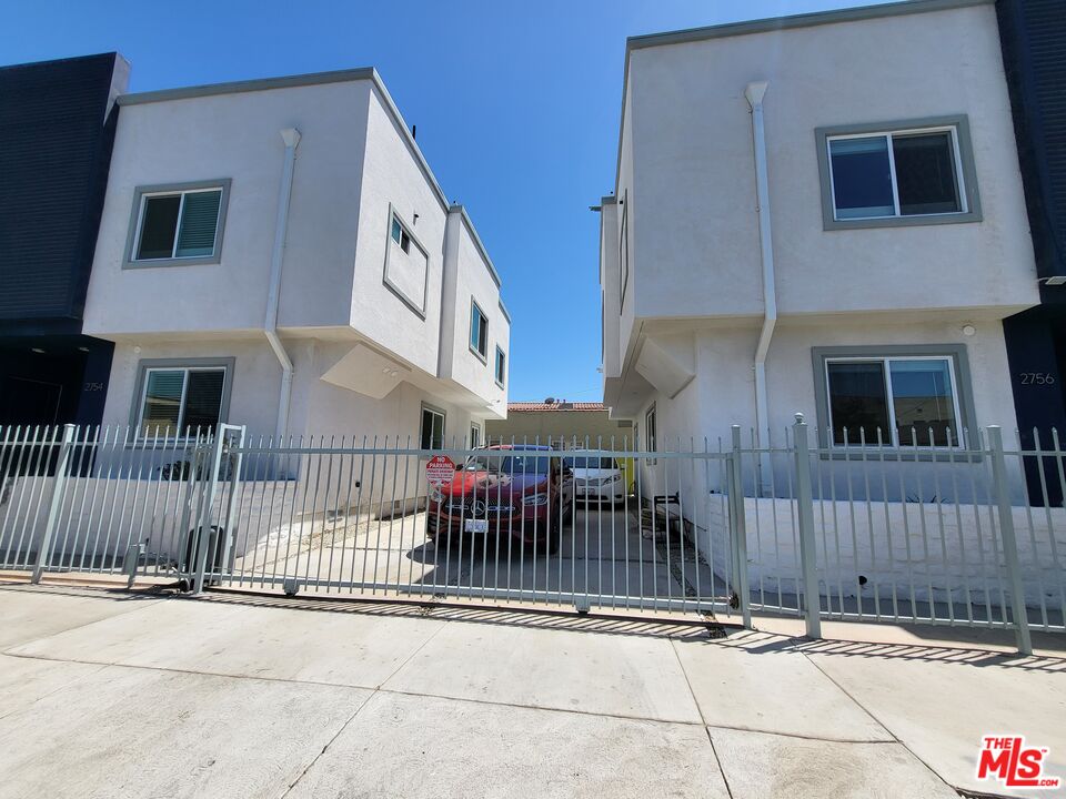2754 West 12th Street Los Angeles, CA 90006 - Photo 17 of 17 a view of a brick house with many windows