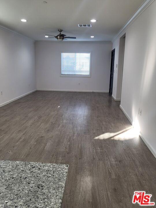 2754 West 12th Street Los Angeles, CA 90006 - Photo 3 of 17 en empty room with wooden floor and window