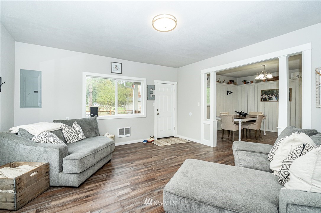 443 Tucker Road Toledo, WA 98591 - Photo 11 of 39 a living room with furniture and a large window