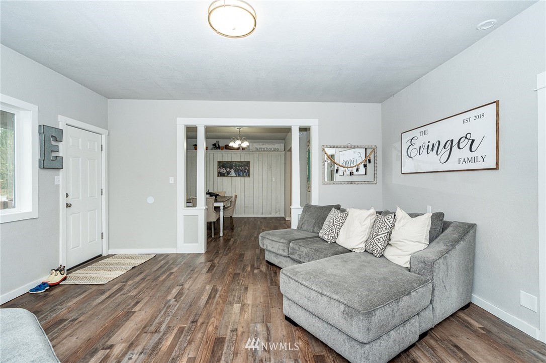 443 Tucker Road Toledo, WA 98591 - Photo 13 of 39 a living room with furniture and wooden floor