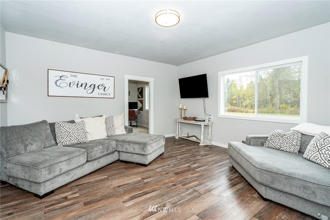 443 Tucker Road Toledo, WA 98591 - Photo 14 of 39 a living room with furniture and a flat screen tv