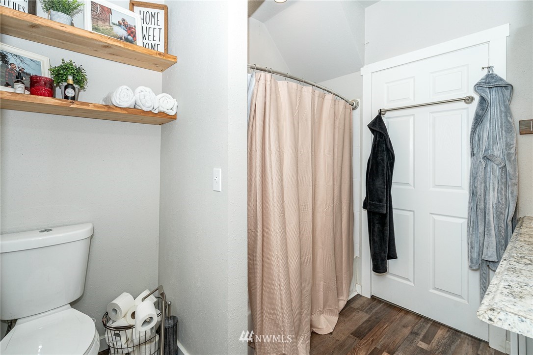 443 Tucker Road Toledo, WA 98591 - Photo 20 of 39 a white toilet sitting next to a bathroom sink