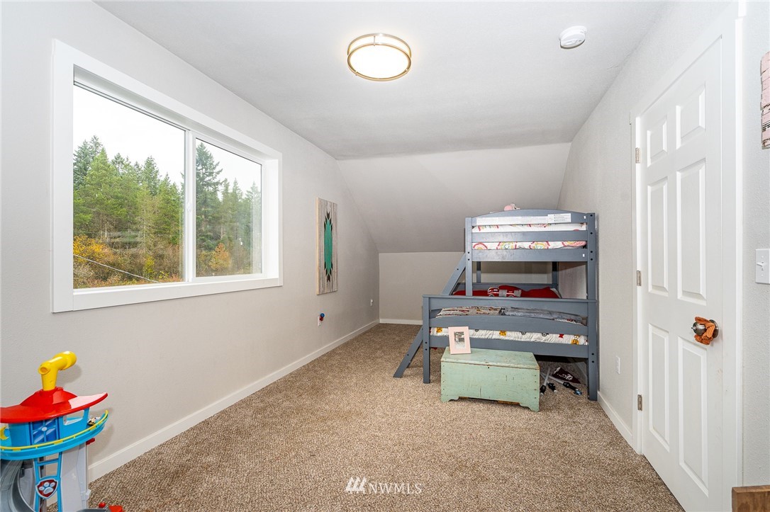 443 Tucker Road Toledo, WA 98591 - Photo 22 of 39 a room with furniture and a window