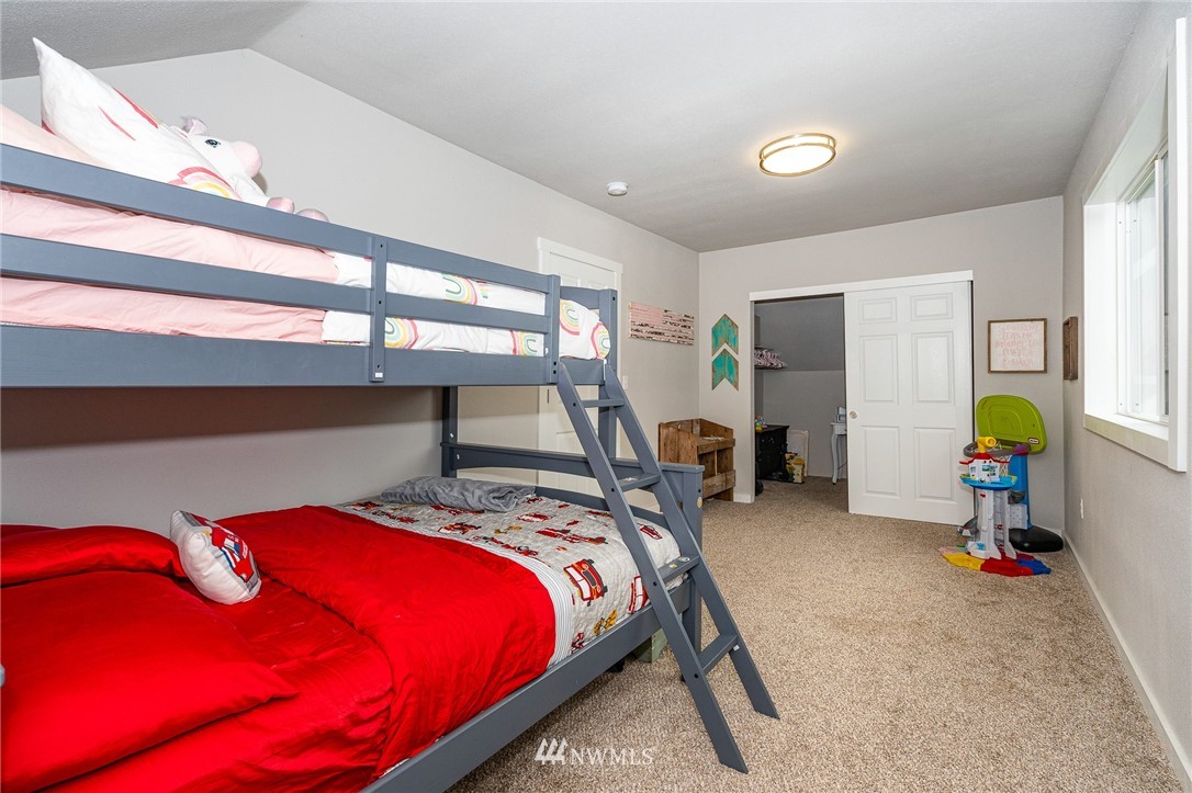 443 Tucker Road Toledo, WA 98591 - Photo 24 of 39 a bed sitting in a room next to a window
