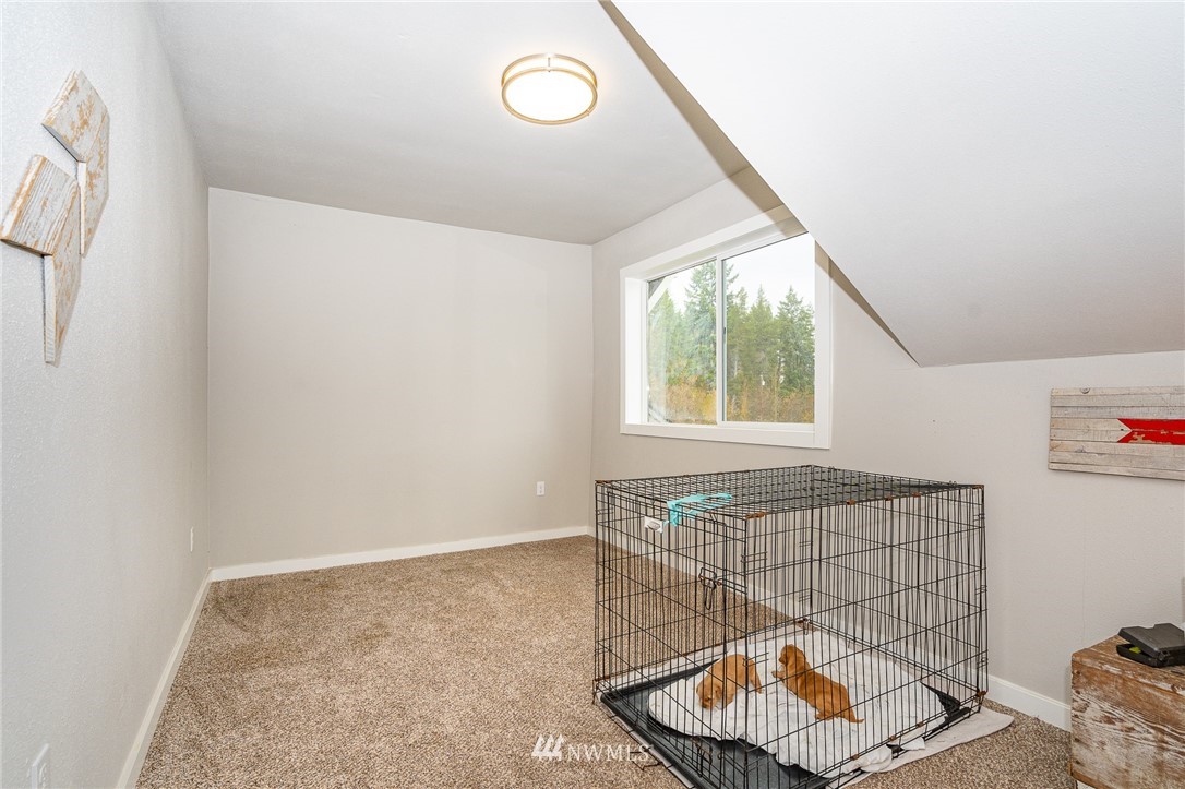 443 Tucker Road Toledo, WA 98591 - Photo 25 of 39 a view of a room that has a window and a rug