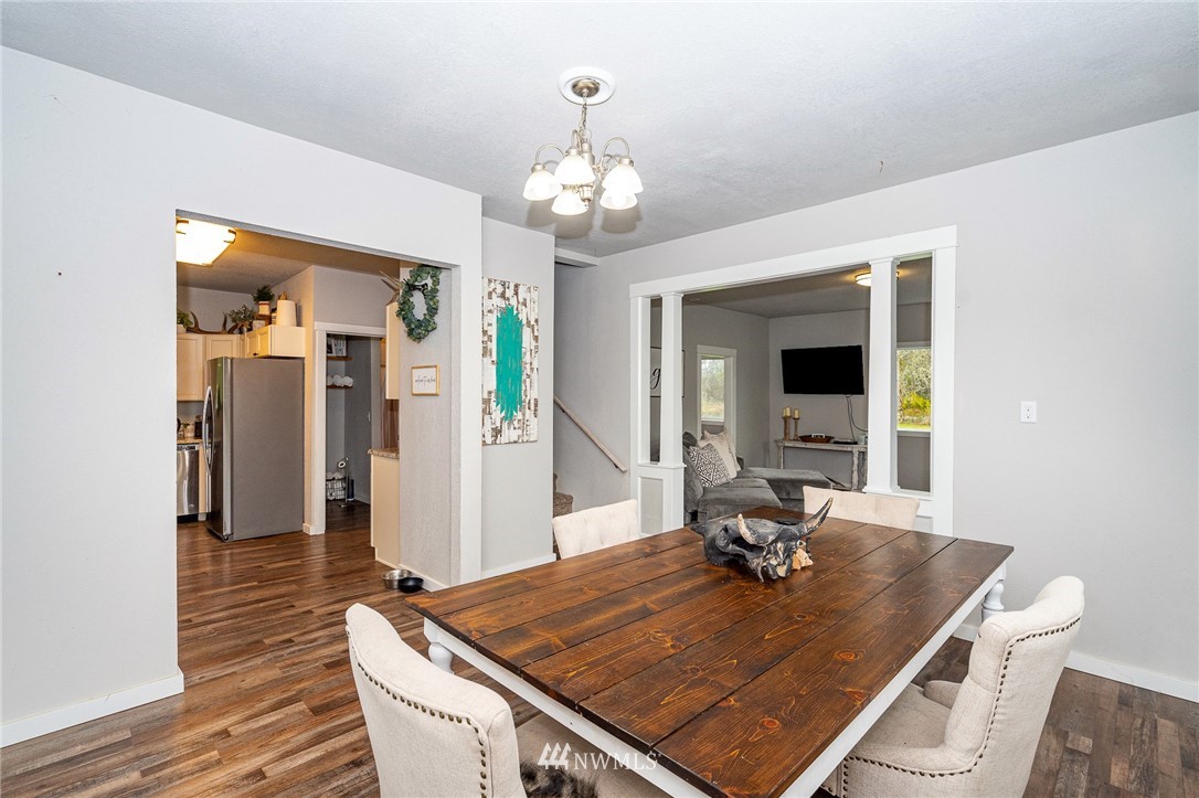 443 Tucker Road Toledo, WA 98591 - Photo 4 of 39 a view of a dining room with furniture and a chandelier