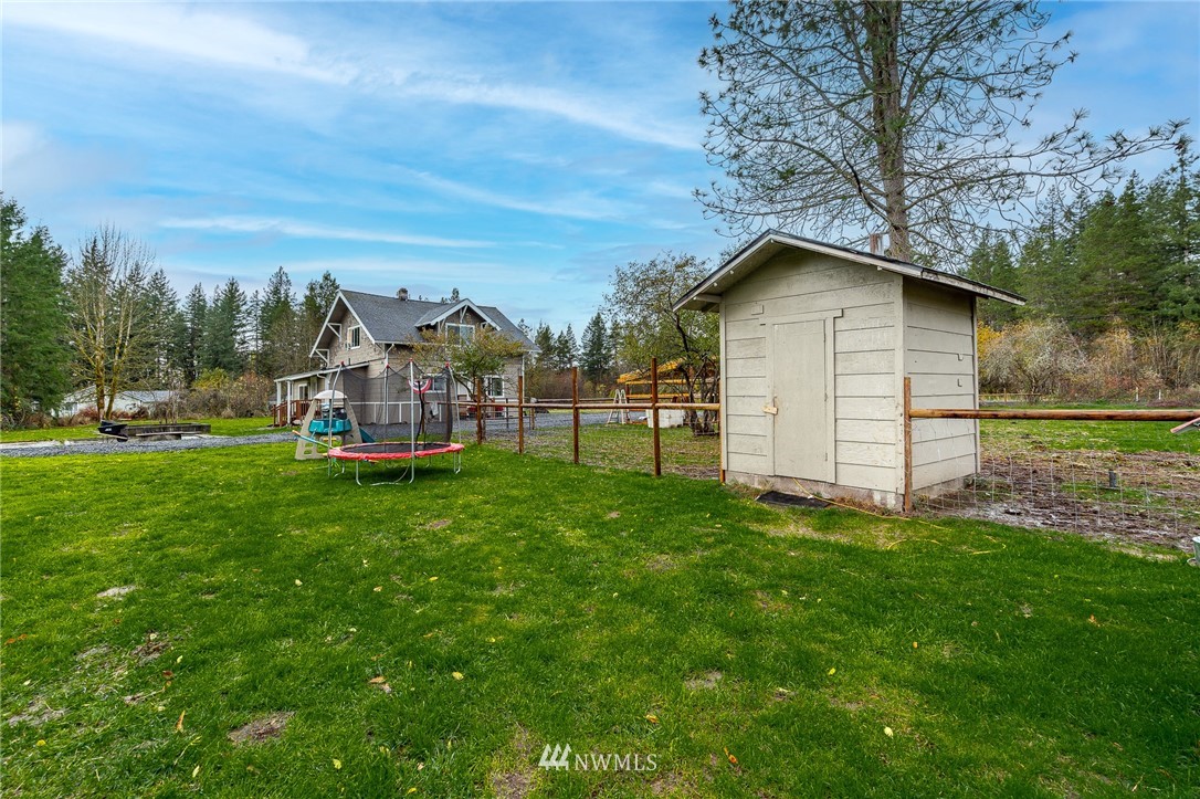 443 Tucker Road Toledo, WA 98591 - Photo 34 of 39 a view of a yard with a house in the background