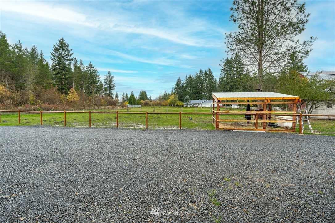443 Tucker Road Toledo, WA 98591 - Photo 35 of 39 a view of a field with fence and trees in the background