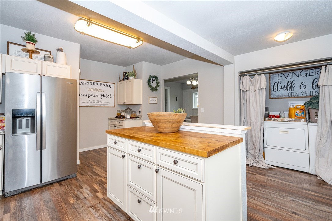 443 Tucker Road Toledo, WA 98591 - Photo 6 of 39 a kitchen with stainless steel appliances granite countertop a refrigerator and a sink