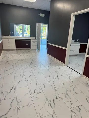 a large bathroom with a sink and a mirror