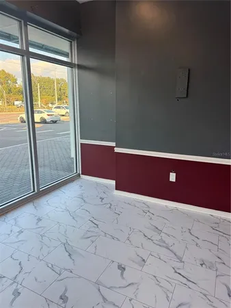 a view of an empty room and window