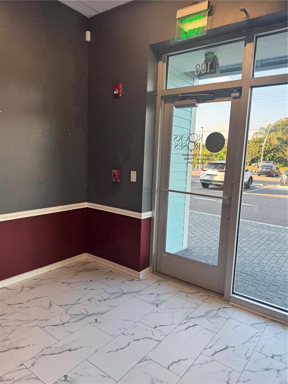 5113 Highway 674 Wimauma, FL 33598 - Photo 4 of 16 a view of a front door of the house