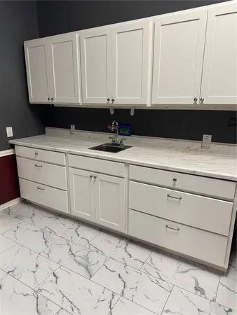 a white toilet sitting next to a bathroom sink