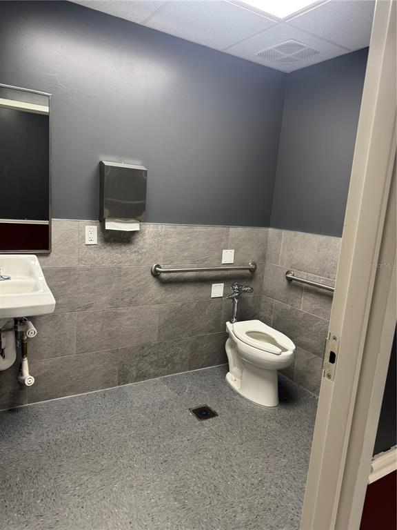 5113 Highway 674 Wimauma, FL 33598 - Photo 8 of 16 a white toilet sitting next to a bathroom sink