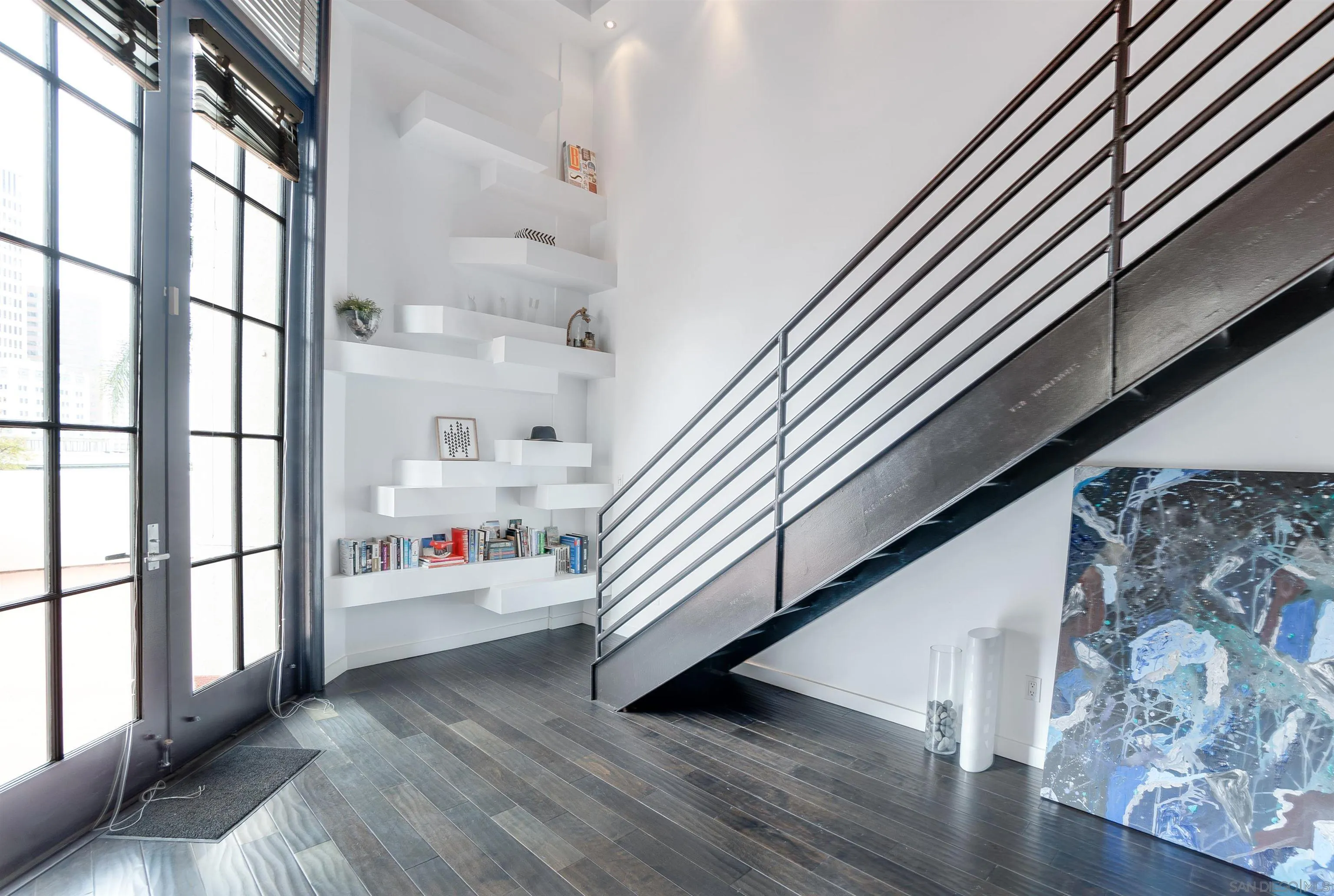 702 Ash Street, Unit 102 San Diego, CA 92101 - Photo 13 of 31 a view of an entryway with wooden floor