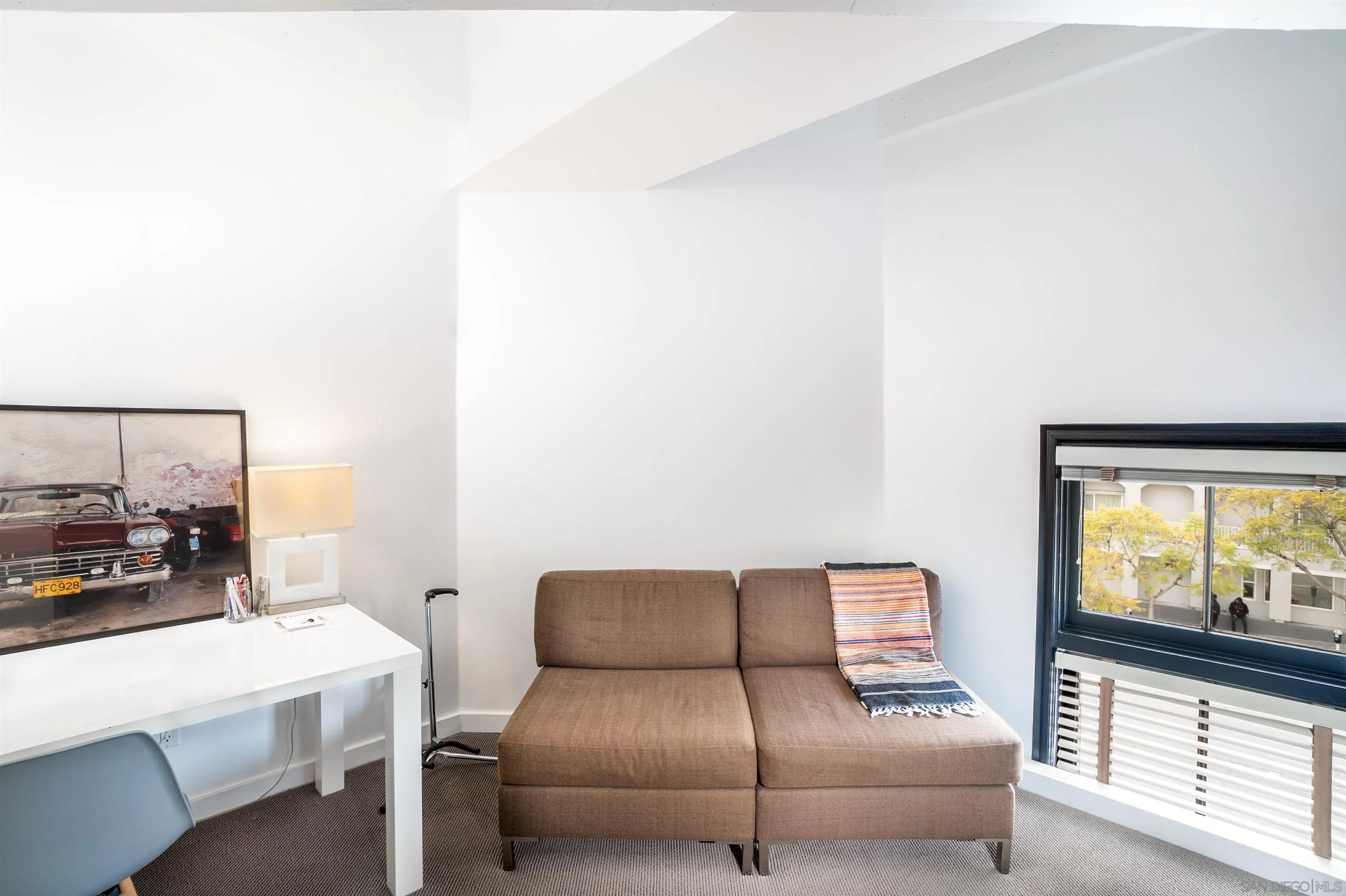 702 Ash Street, Unit 102 San Diego, CA 92101 - Photo 19 of 31 a living room with furniture and a flat screen tv
