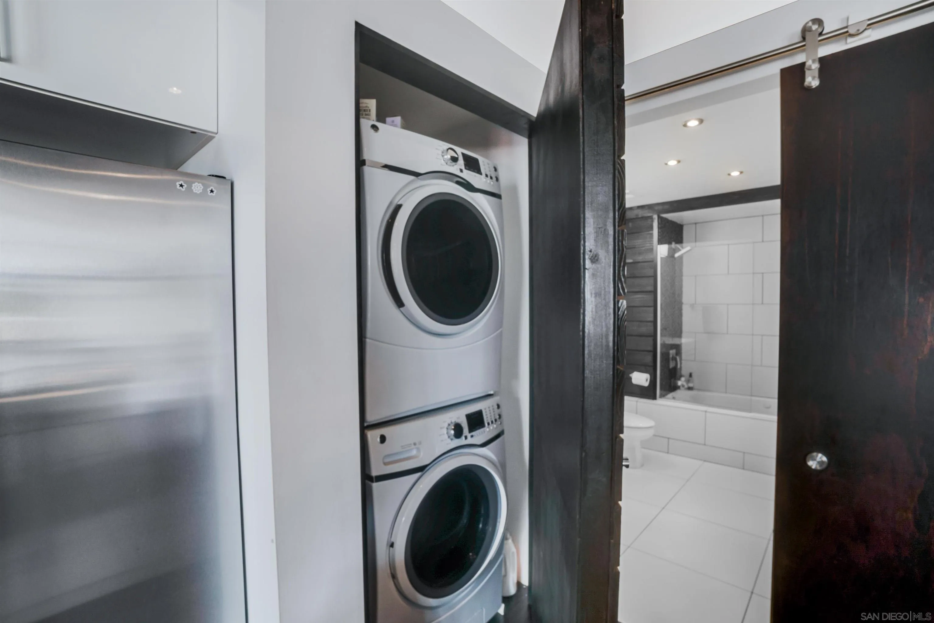 702 Ash Street, Unit 102 San Diego, CA 92101 - Photo 21 of 31 a utility room with dryer and washer