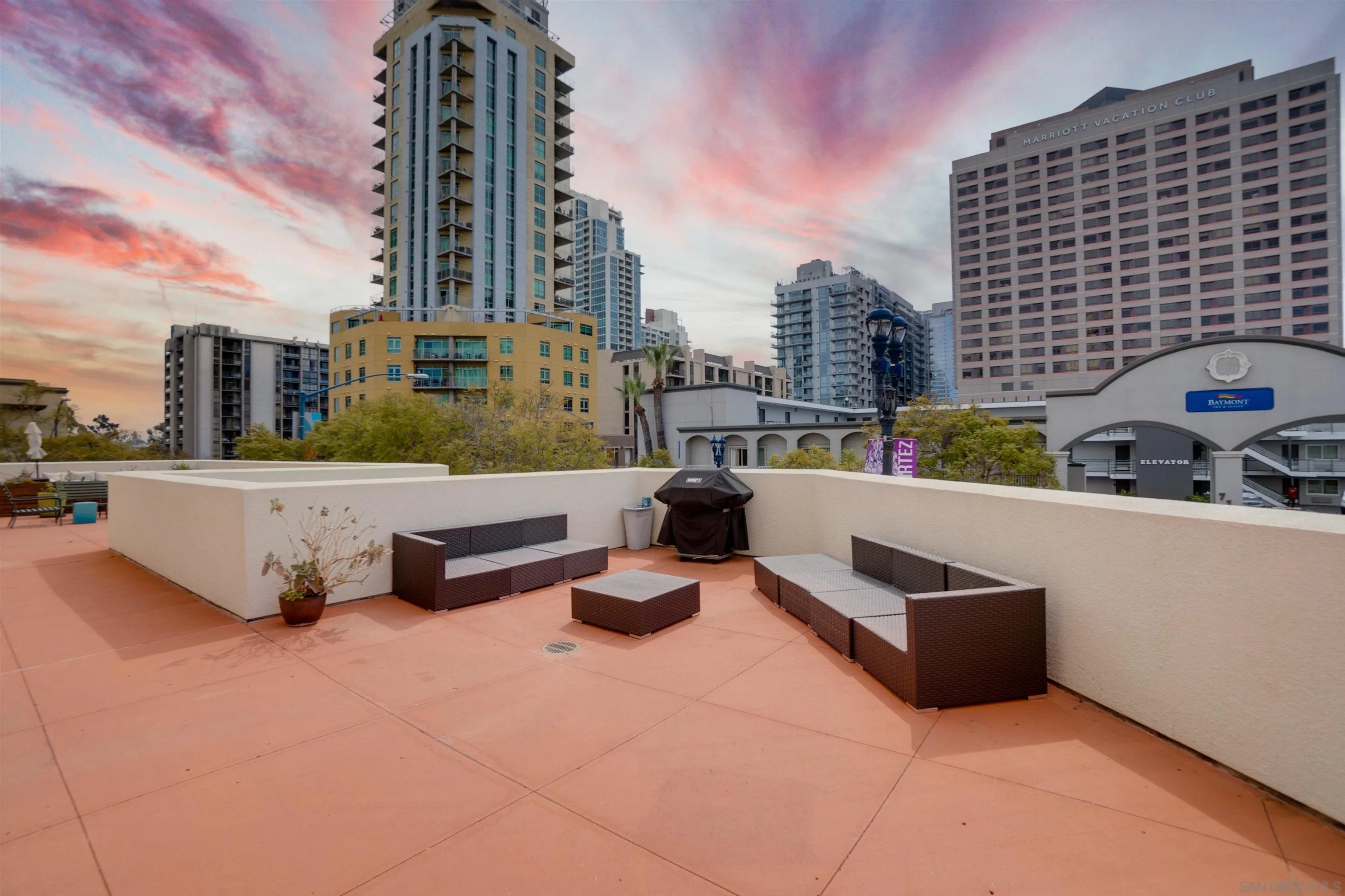 702 Ash Street, Unit 102 San Diego, CA 92101 - Photo 25 of 31 a swimming pool with outdoor seating and city view