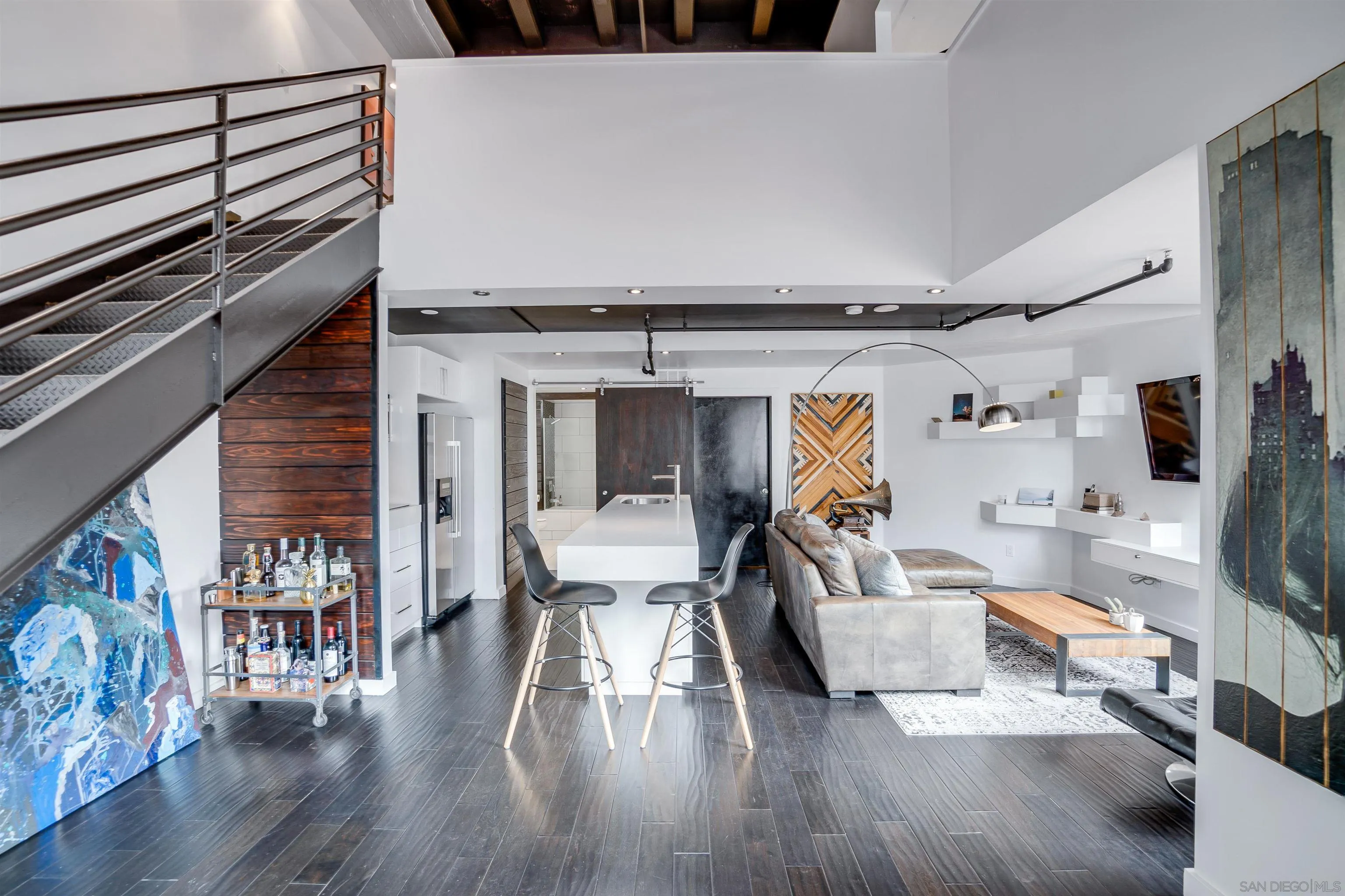 702 Ash Street, Unit 102 San Diego, CA 92101 - Photo 4 of 31 a living room with furniture and a flat screen tv