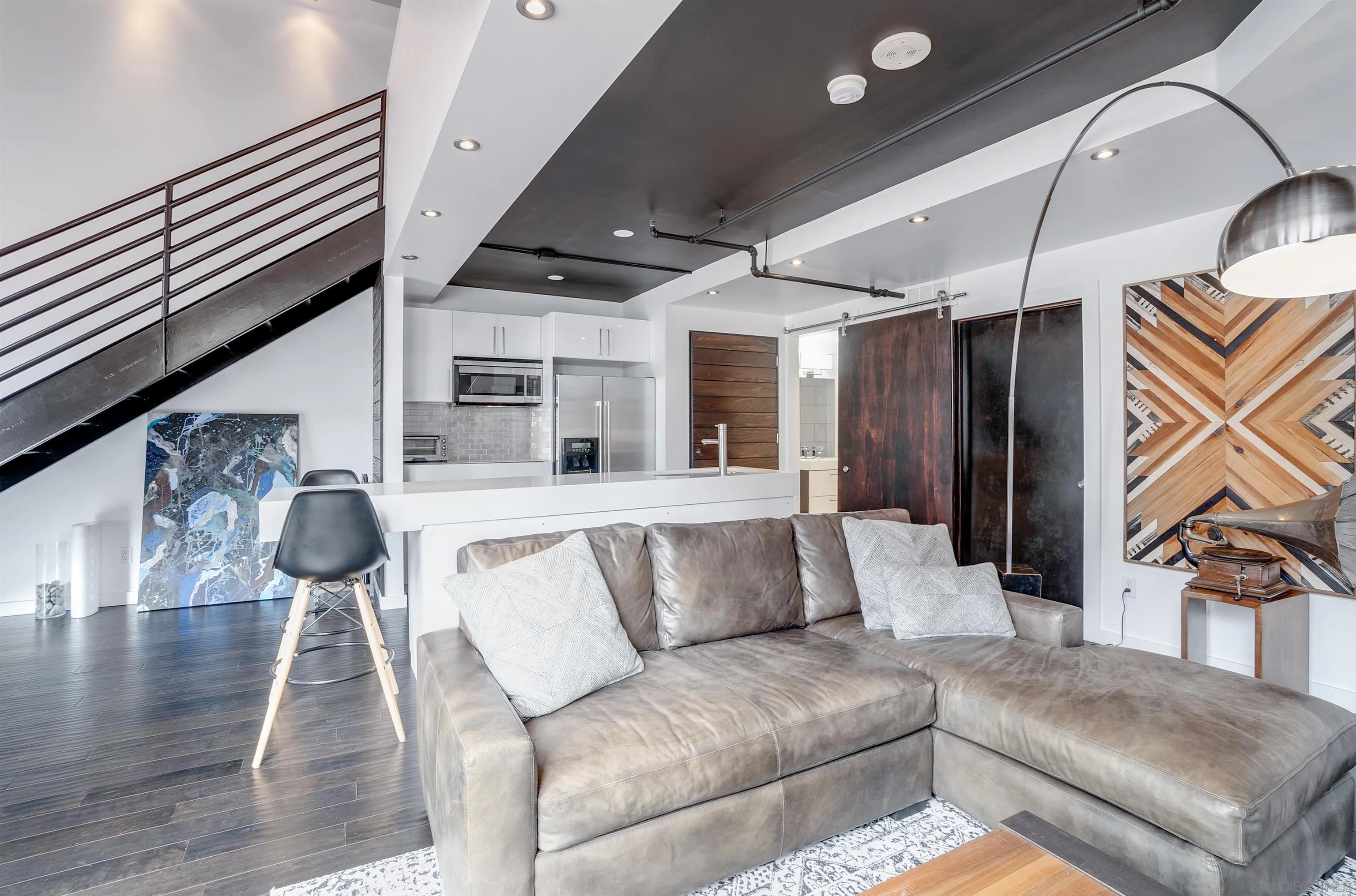 702 Ash Street, Unit 102 San Diego, CA 92101 - Photo 7 of 31 a living room with furniture and wooden floor