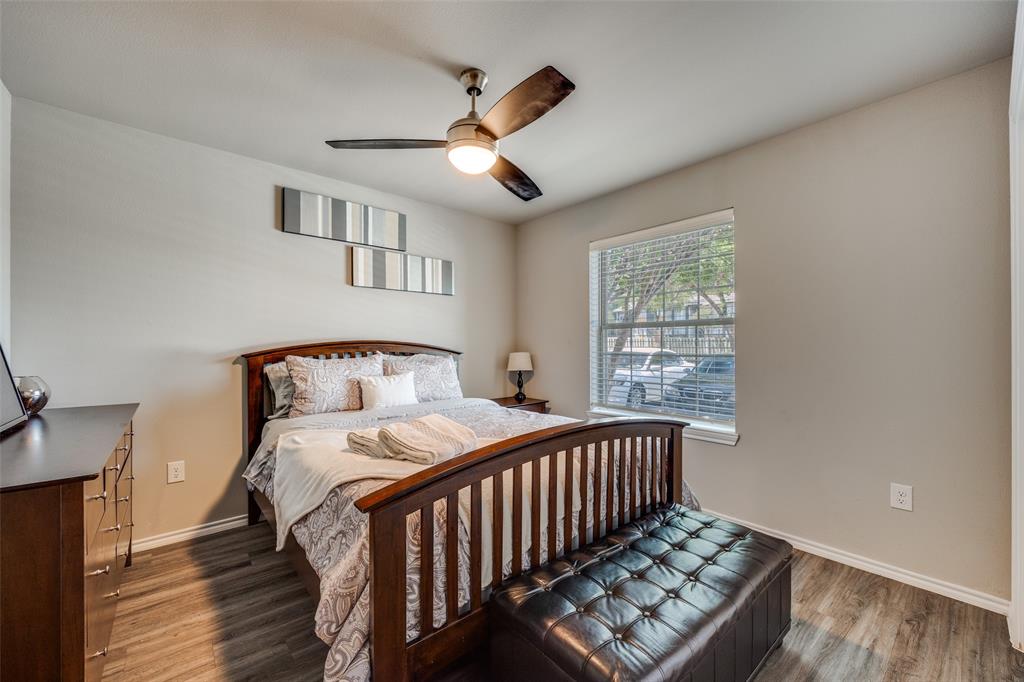 6108 Abrams Road, Unit 205 Dallas, TX 75231 - Photo 9 of 12 Bedroom with wood finished floors and ceiling fan