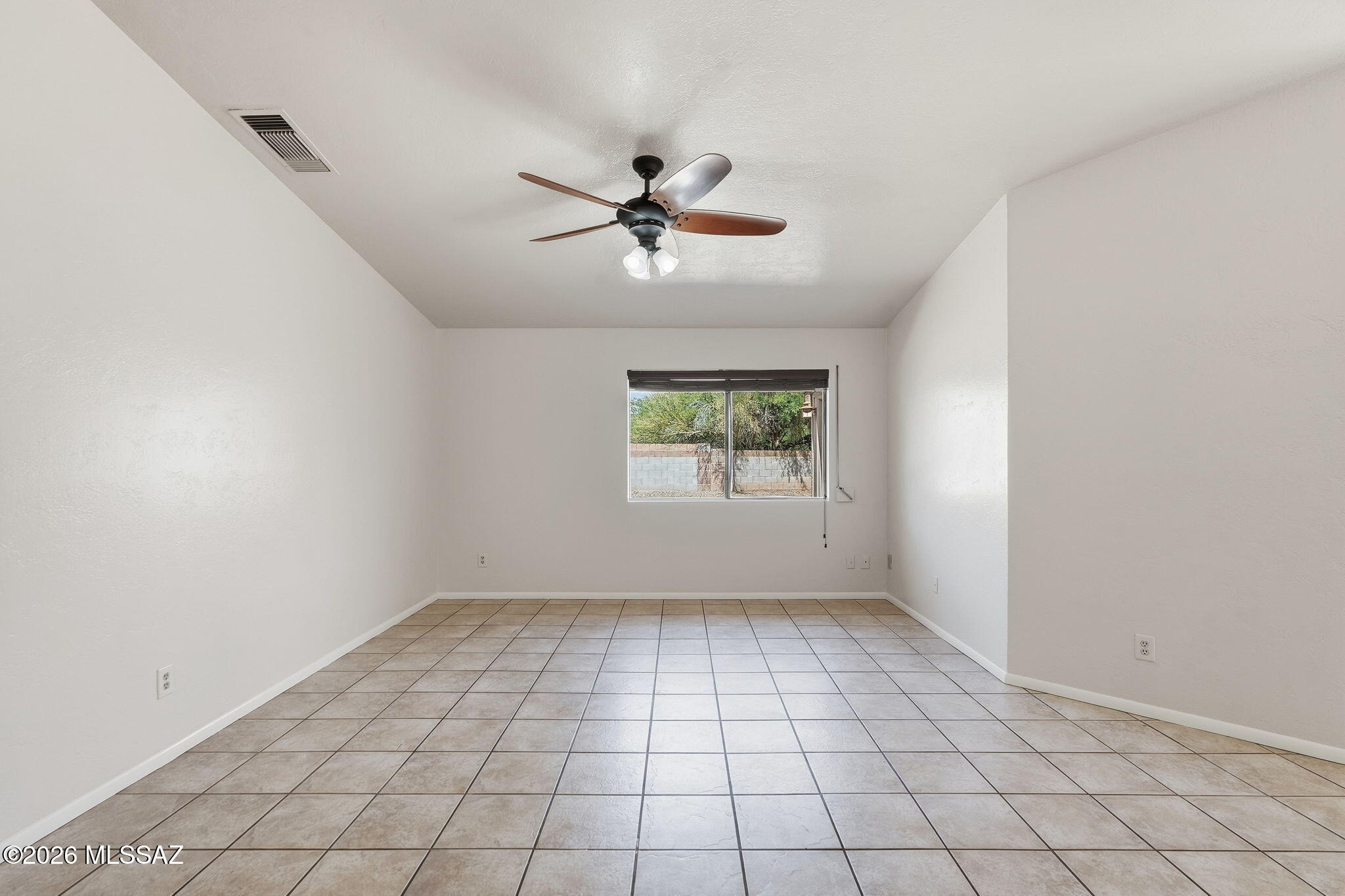 5791 North Moonbrook Road Tucson, AZ 85741 - Photo 11 of 40 Great Room with Outside Rolling Shutters