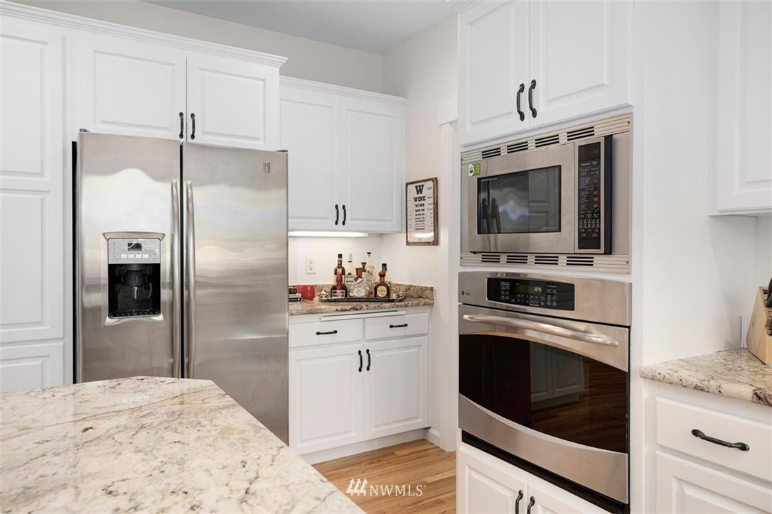 18906 Ross Road Bothell, WA 98011 - Photo 12 of 34 a kitchen with a refrigerator stove and microwave