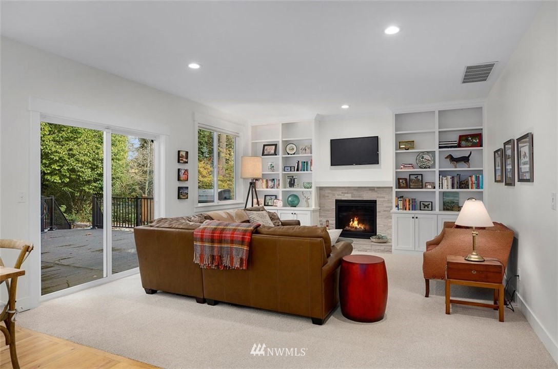 18906 Ross Road Bothell, WA 98011 - Photo 15 of 34 a living room with furniture and a fireplace