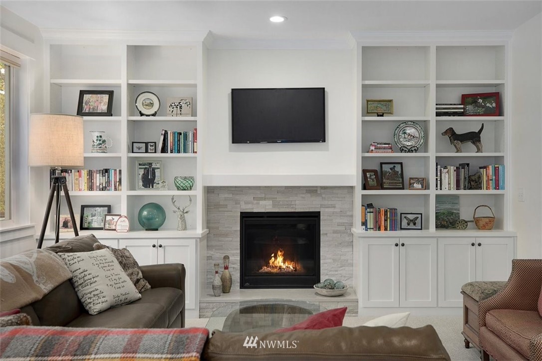 18906 Ross Road Bothell, WA 98011 - Photo 17 of 34 a living room with furniture and a fireplace