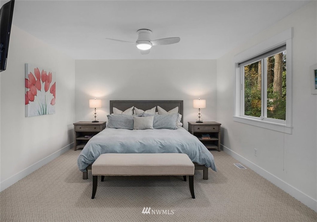 18906 Ross Road Bothell, WA 98011 - Photo 22 of 34 a bedroom with a bed and a window