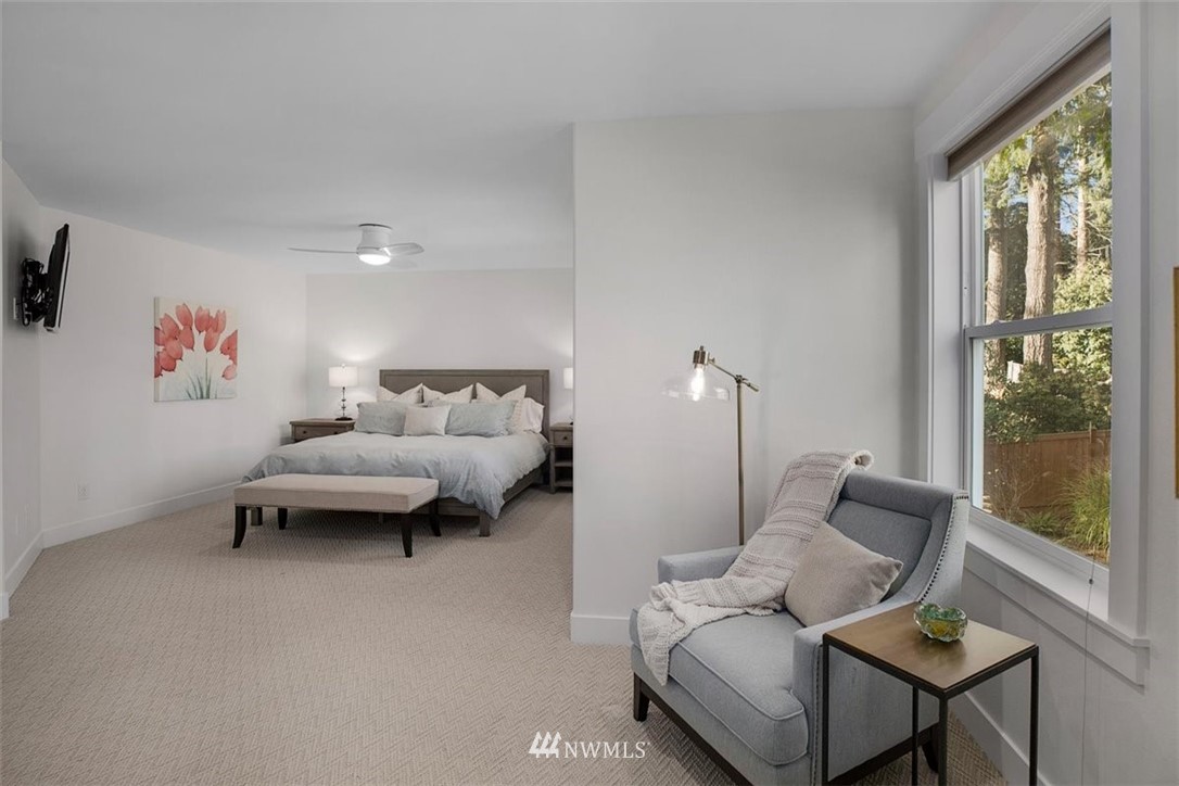 18906 Ross Road Bothell, WA 98011 - Photo 23 of 34 a living room with furniture and a large window