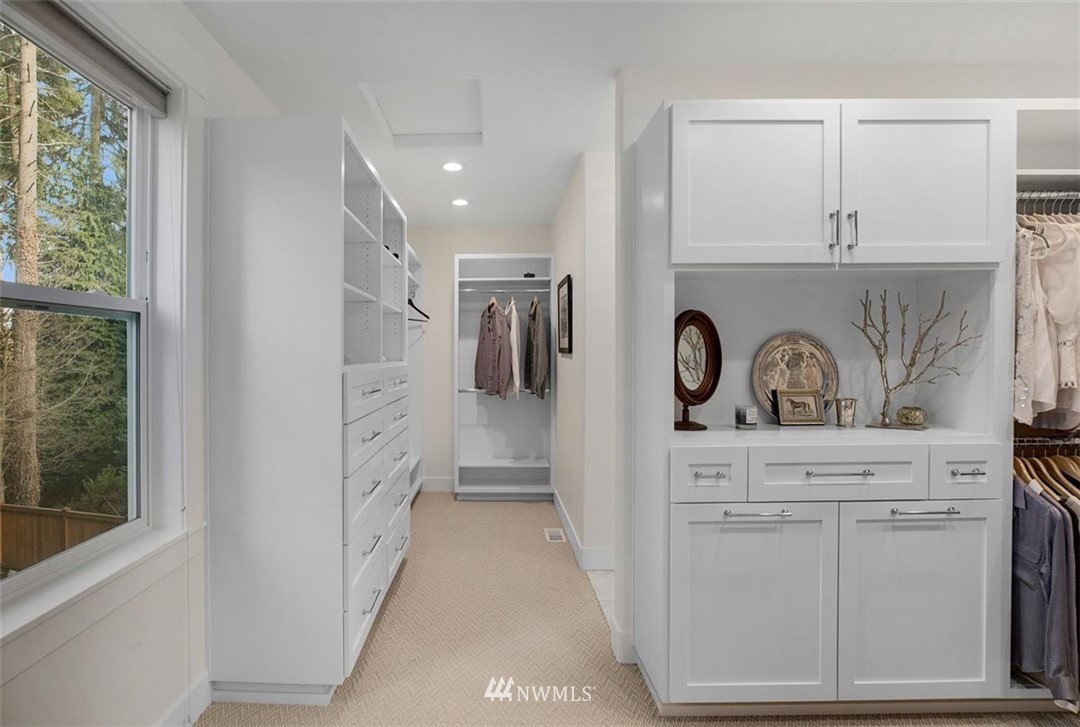 18906 Ross Road Bothell, WA 98011 - Photo 24 of 34 a view of a hallway that has closet with wooden floor