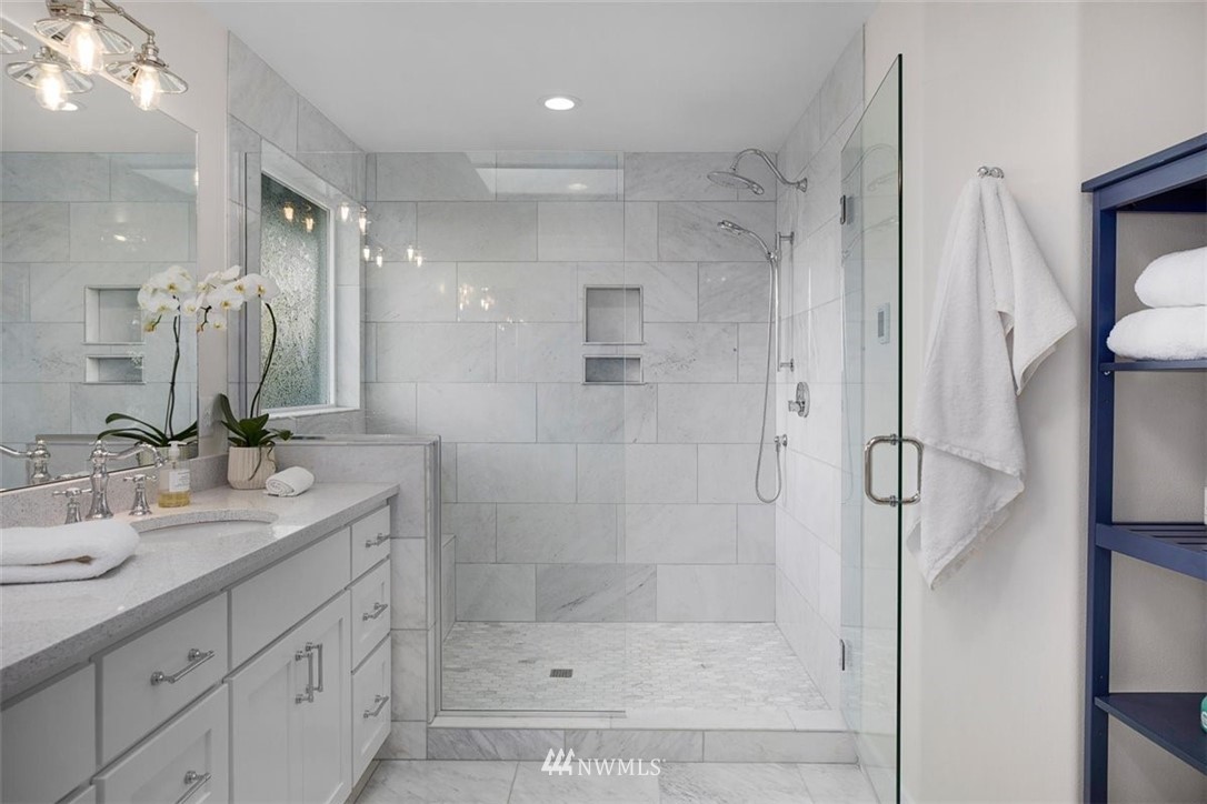 18906 Ross Road Bothell, WA 98011 - Photo 27 of 34 a bathroom with a shower sink and mirror