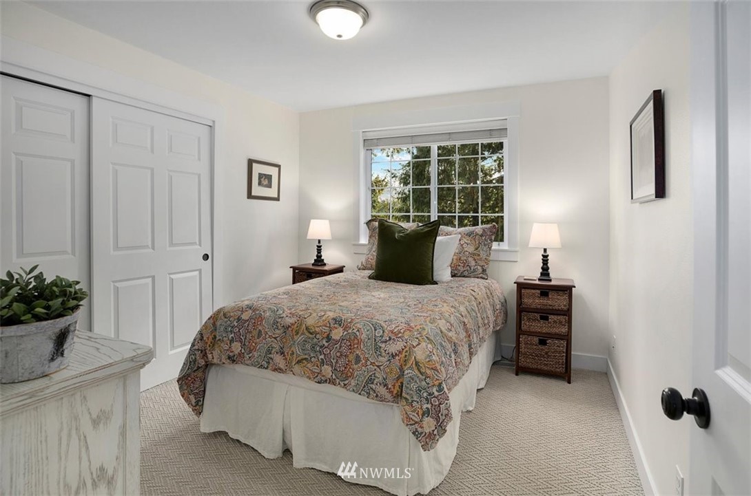 18906 Ross Road Bothell, WA 98011 - Photo 29 of 34 a bedroom with a bed and a potted plant