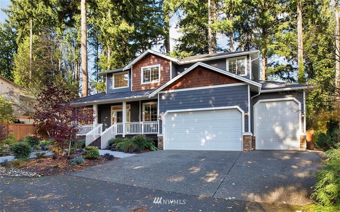 18906 Ross Road Bothell, WA 98011 - Photo 34 of 34 a front view of a house with a yard and garage