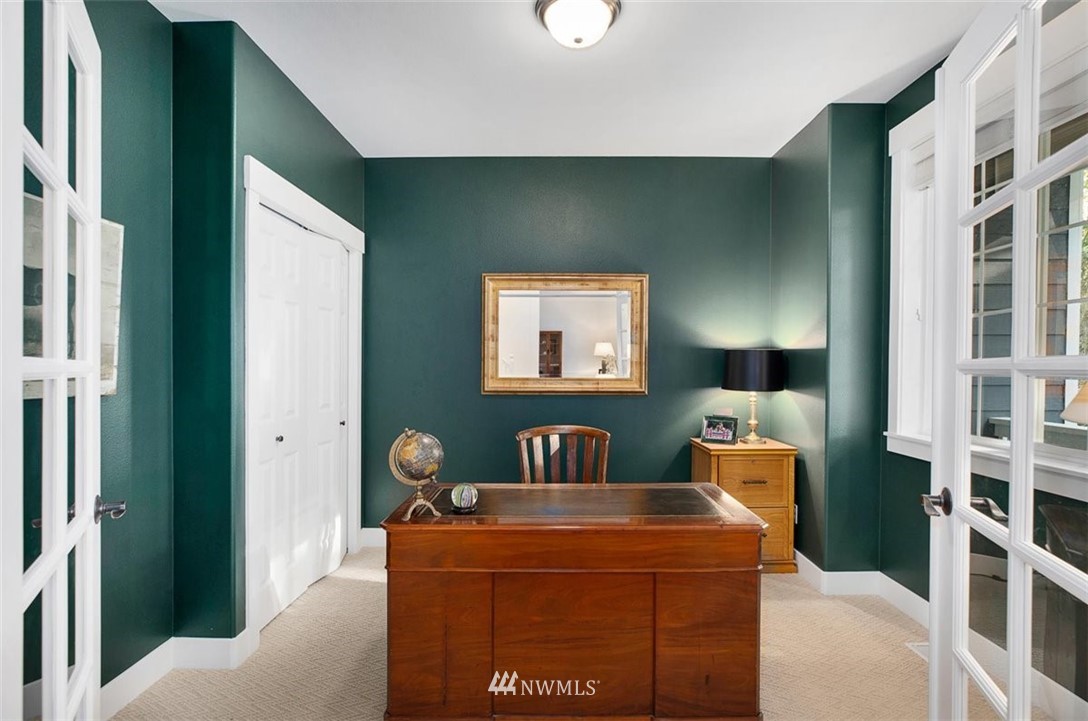 18906 Ross Road Bothell, WA 98011 - Photo 8 of 34 a living room with furniture a lamp and a window