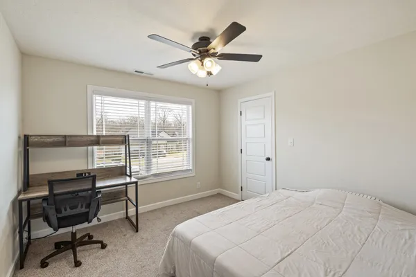 a bathroom with a sink a toilet and window