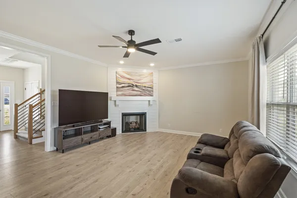 a living room with furniture and a flat screen tv