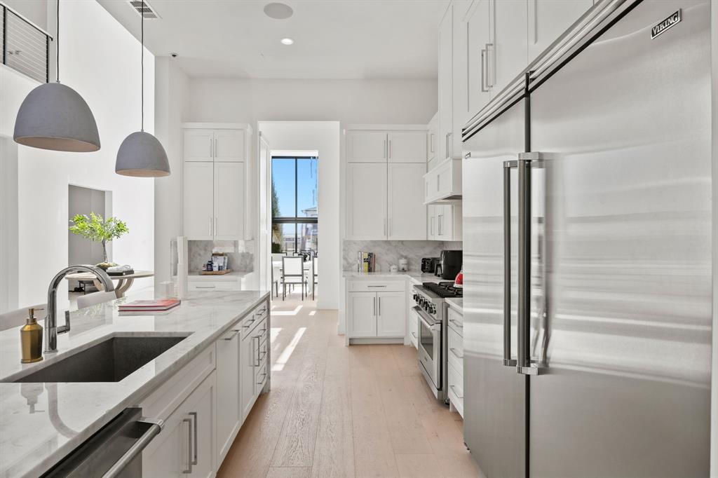 2509 Bella Ridge Keller, TX 76262 - Photo 13 of 34 a kitchen with refrigerator and sink