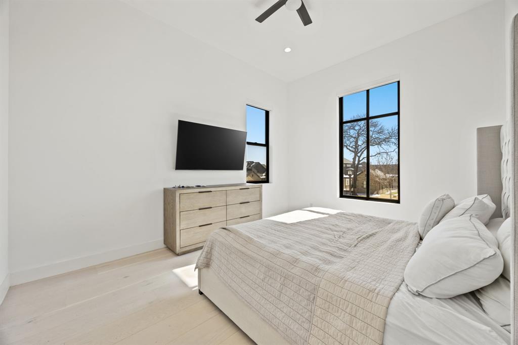 2509 Bella Ridge Keller, TX 76262 - Photo 20 of 34 a bedroom with a bed and a flat screen tv