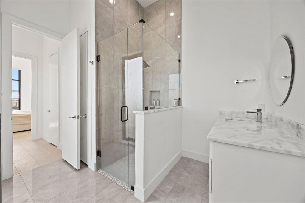 2509 Bella Ridge Keller, TX 76262 - Photo 21 of 34 a bathroom with a granite countertop sink mirror and shower