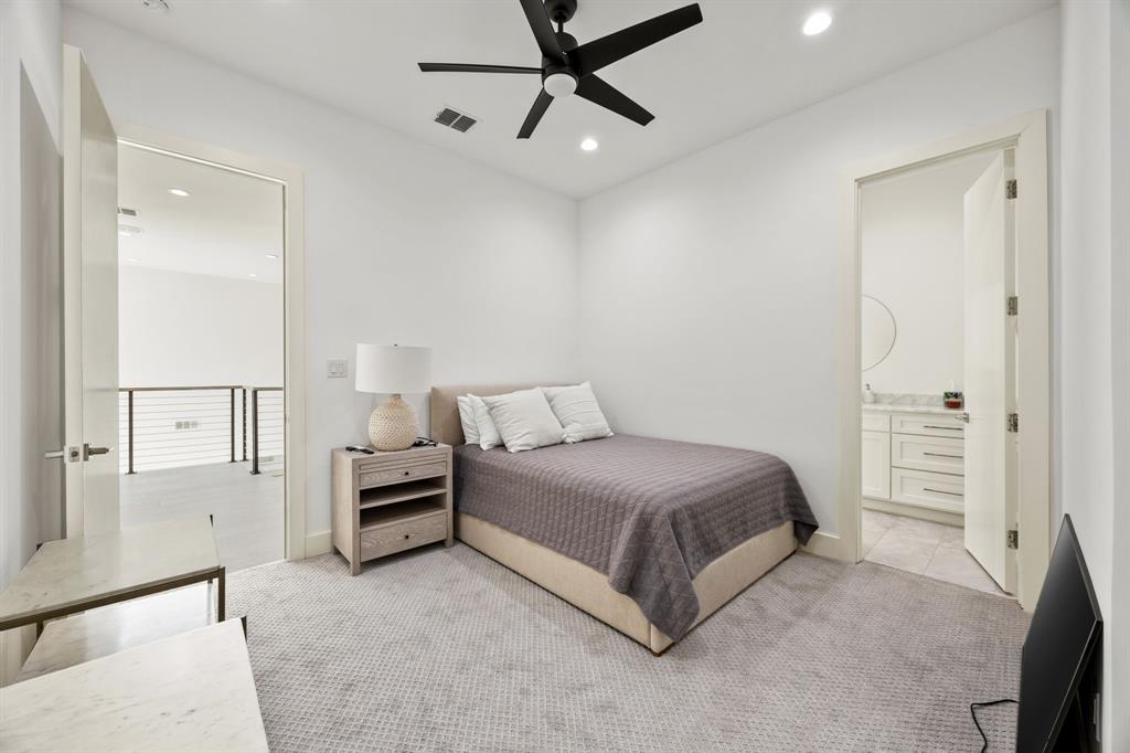 2509 Bella Ridge Keller, TX 76262 - Photo 27 of 34 a spacious bedroom with a bed and cabinets