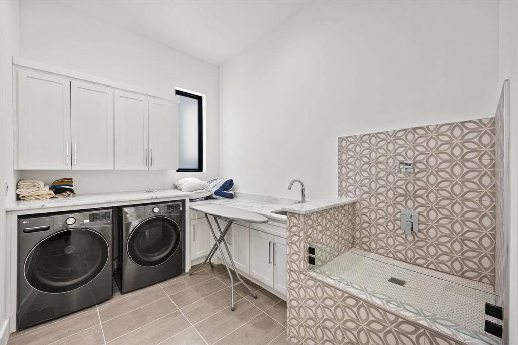 2509 Bella Ridge Keller, TX 76262 - Photo 29 of 34 a bathroom with a sink a washer and dryer