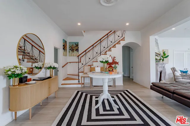 a living room with furniture and a rug
