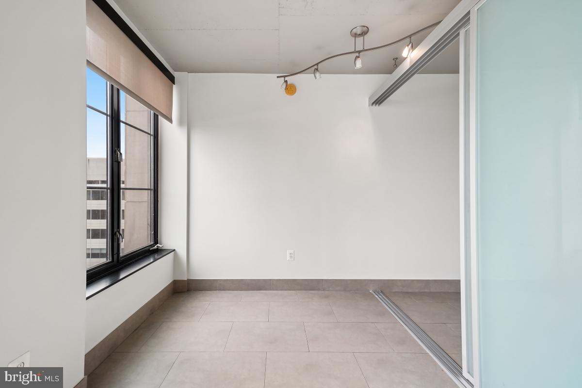 1133 14th Street Northwest, Unit 1103 Washington, DC 20005 - Photo 12 of 39 a view of an empty room with a window