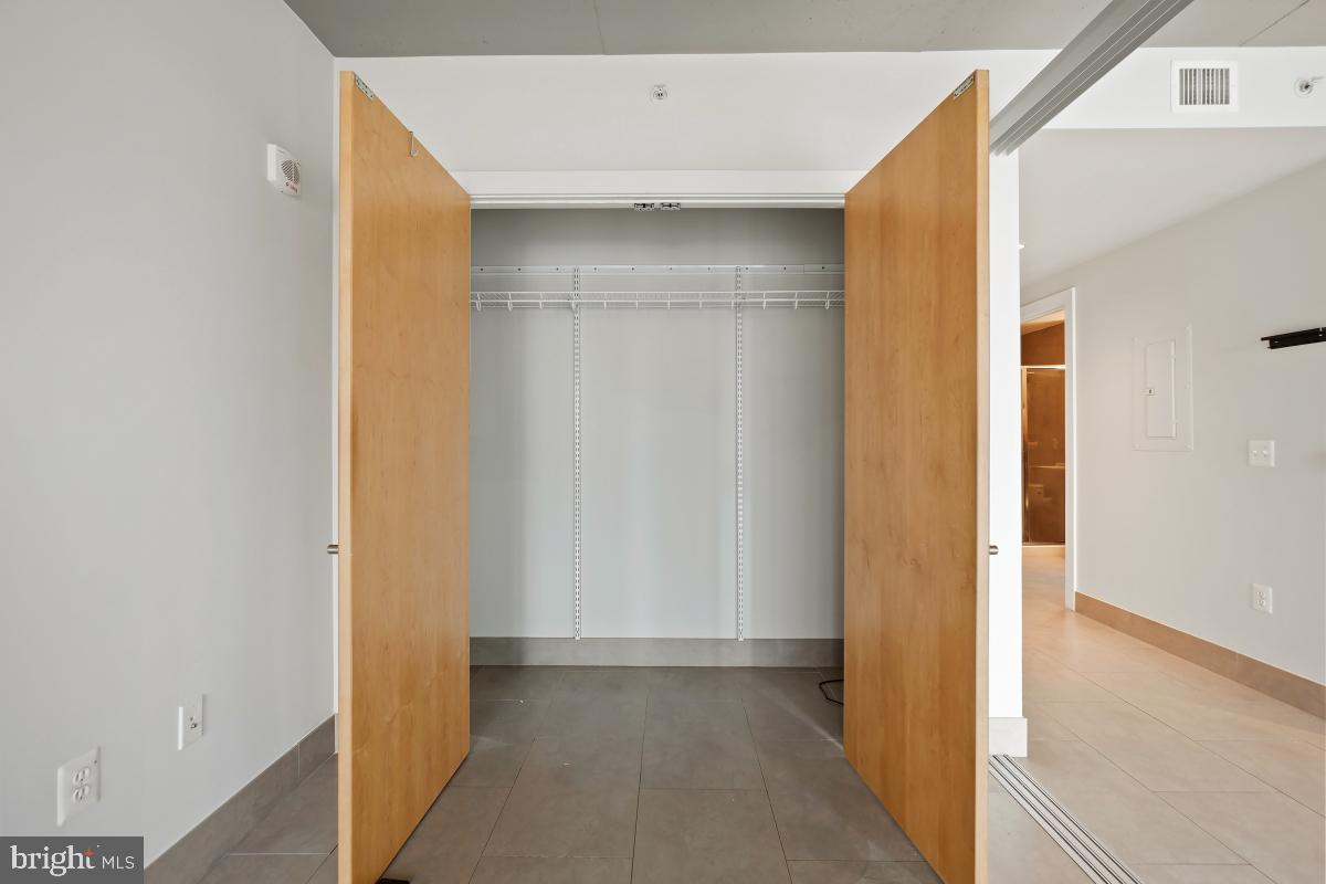 1133 14th Street Northwest, Unit 1103 Washington, DC 20005 - Photo 18 of 39 a view of a room with a hallway