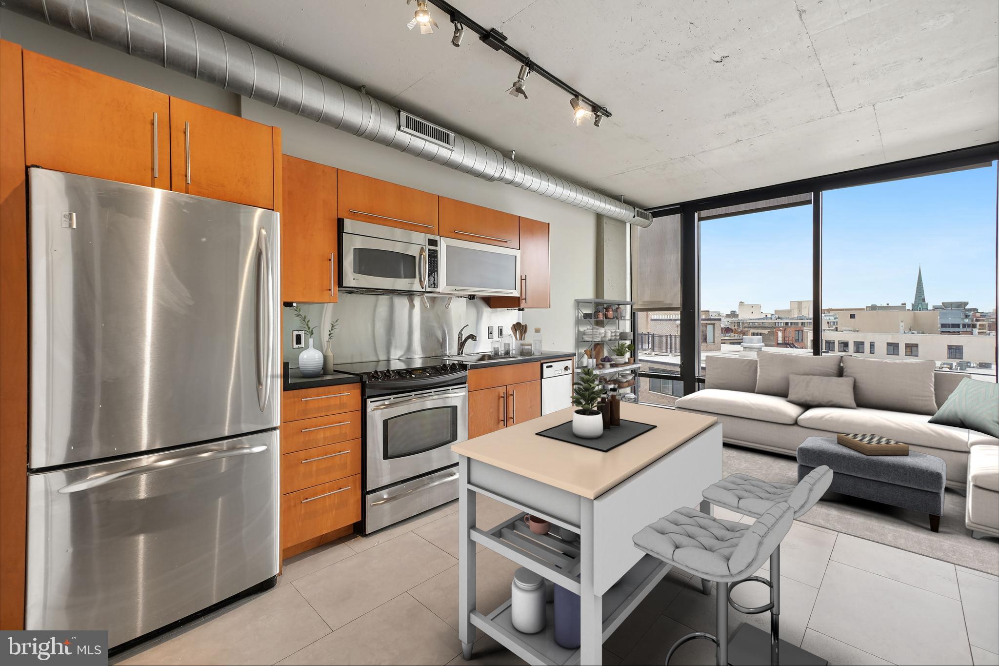1133 14th Street Northwest, Unit 1103 Washington, DC 20005 - Photo 2 of 39 a kitchen with stainless steel appliances a refrigerator a stove and white cabinets