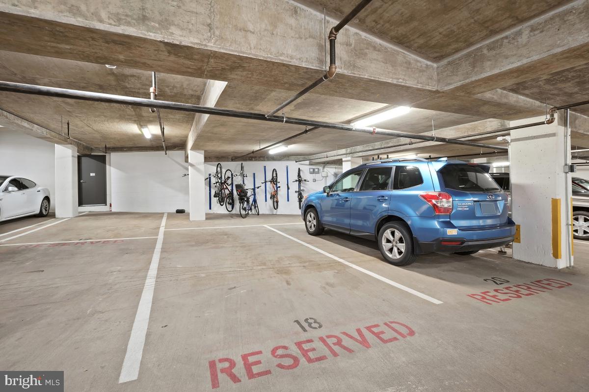 1133 14th Street Northwest, Unit 1103 Washington, DC 20005 - Photo 23 of 39 a view of parking garage with cars