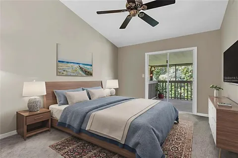 a bedroom with a large bed and a window